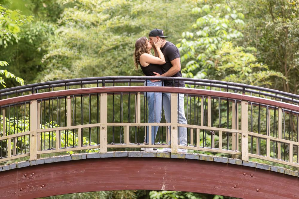romantic engagement portraits at Crim Dell bridge