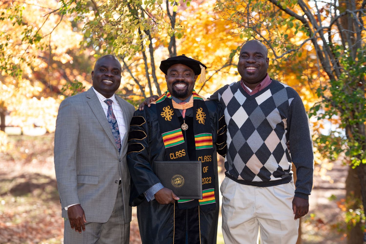 Ph.D. Family Graduation Portraits with New England Fall Foliage with Leah Ramuglia Photography in Milton, MA.