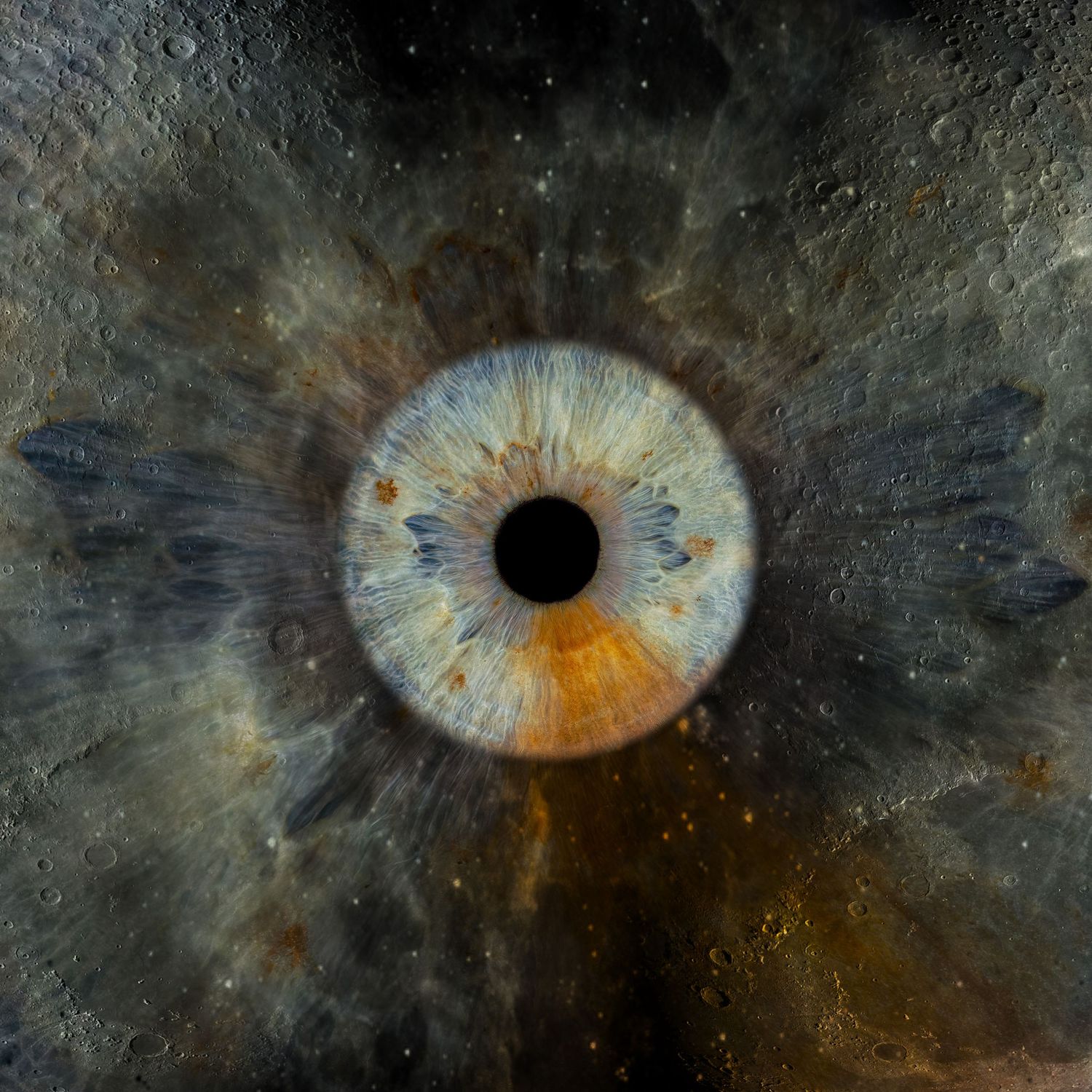 Close-up macro photograph of a human iris showing intricate blue and amber patterns against a black background.