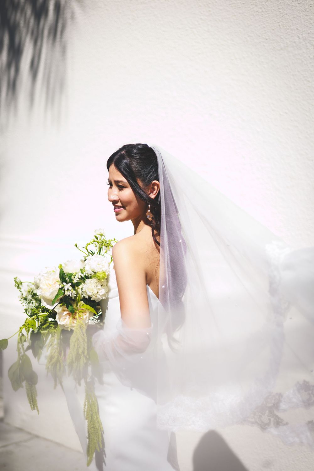 Series of ethereal bridal portraits showing a figure in white against a misty background with delicate flowers.