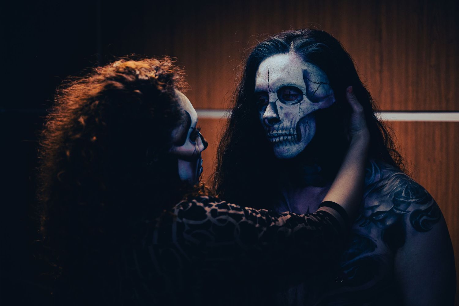 male and female with day of the dead makeup