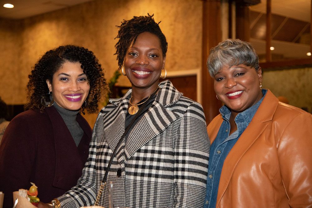 Group of guests enjoying a social gathering at an evening event.