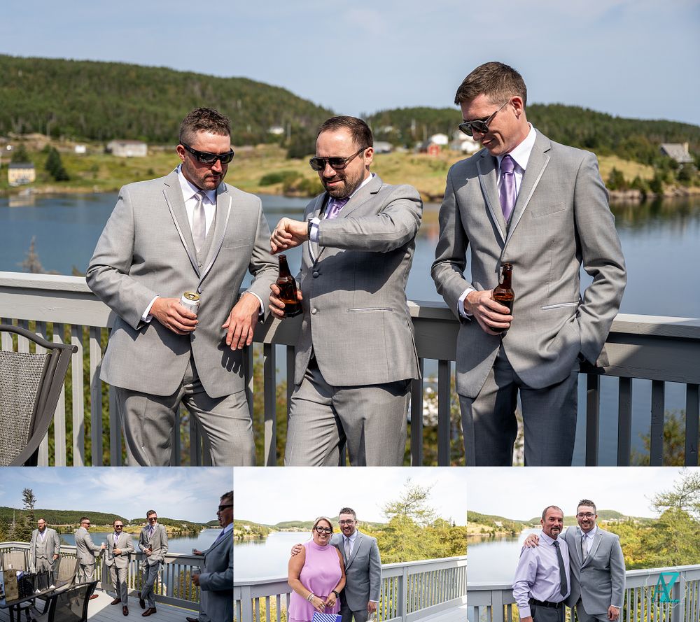 Groomsmen in grey suits checking their watches on a deck overlooking a lake.