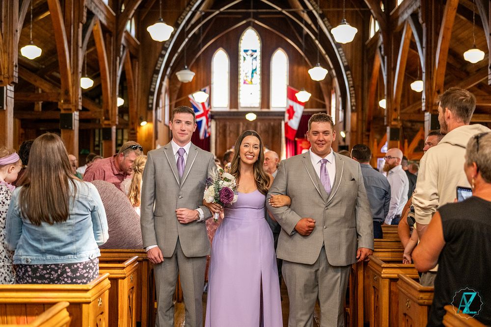 Celebration scene in gothic church with vaulted wooden ceiling and traditional architecture.