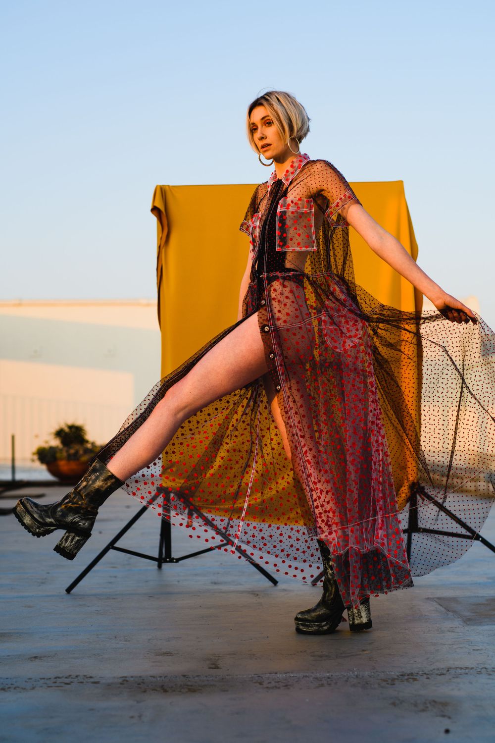 A model posing for a photo on a rooftop in Killarney