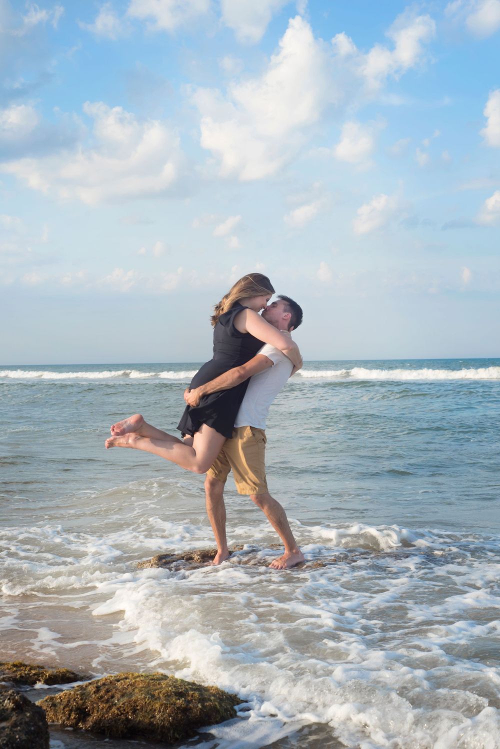 Duo engagement portrait session at River to Sea Preserve in the water at golden hour