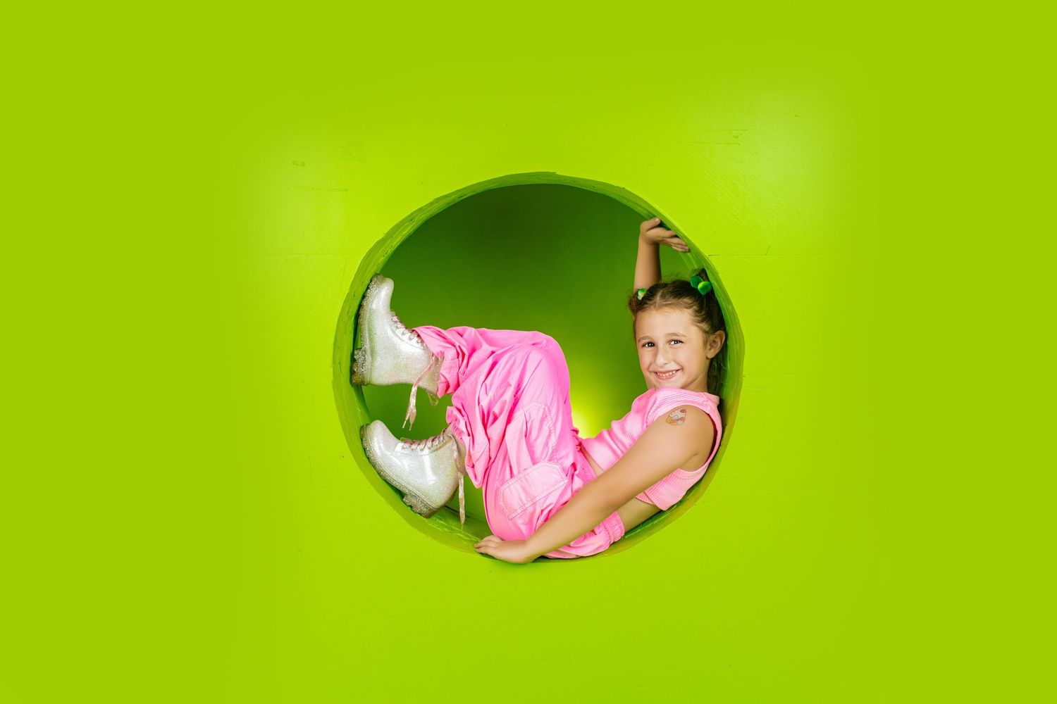 Artistic photos featuring bright lime green backgrounds with circular cutout elements.