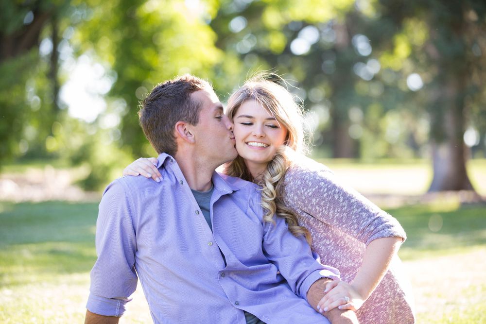 Romantic outdoor portrait session captures tender moments between couple.