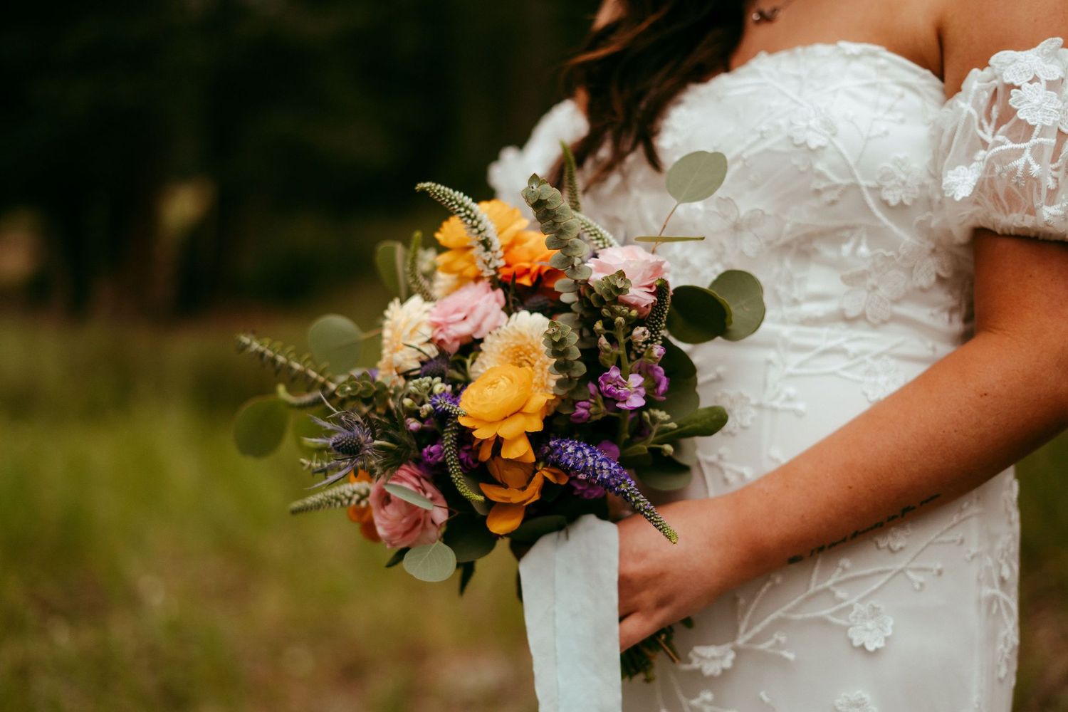 Outdoor wedding ceremony in Wyoming with mountain views and rustic charm