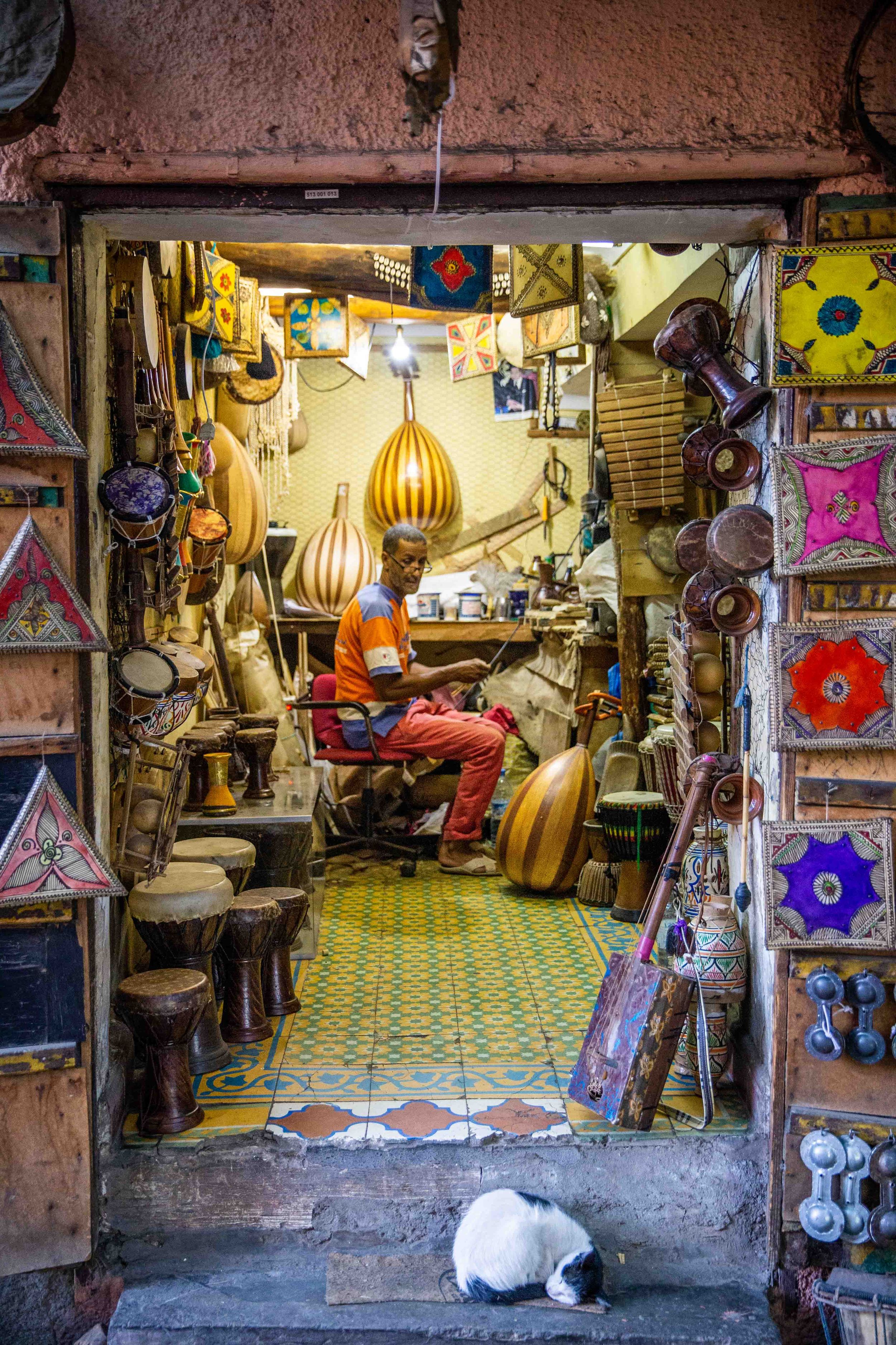 Traditional lamp shop in Moroccan souk with ornate lighting fixtures and decorative items.