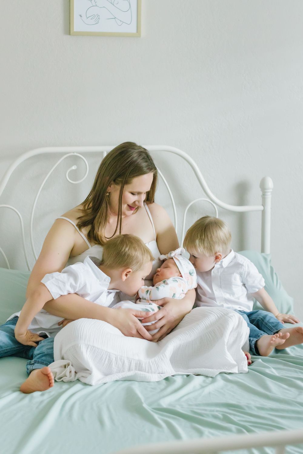 Lifestyle newborn session with mother and children