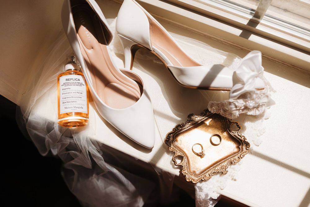 Artistic detail shots of wedding accessories and decor in natural light.