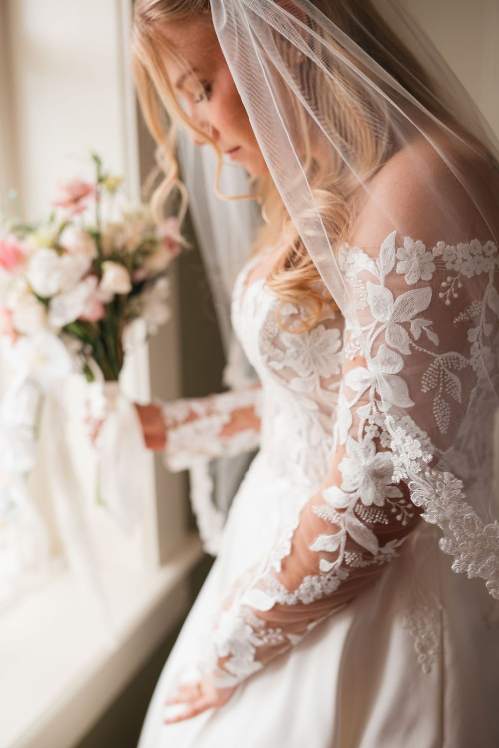 Close-up details of delicate lace patterns on a wedding veil.