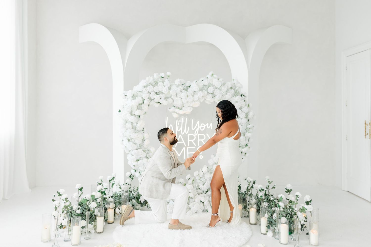 Luxury proposal planner creating romantic engagement decor