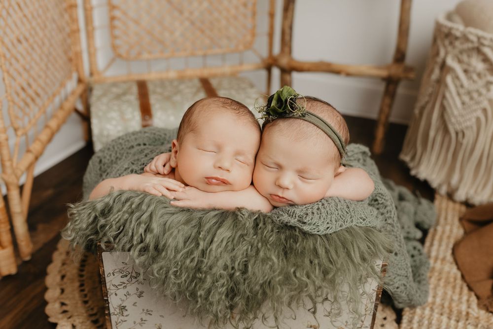 Series of sleeping newborns posed on soft sage green textured blanket in natural light.
