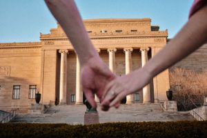 kc engagement photography, hands holding in front of nelson atkins with engagement ring