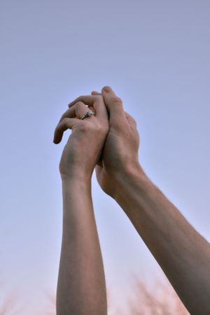 kc engagement session, man and woman hands joined to sky