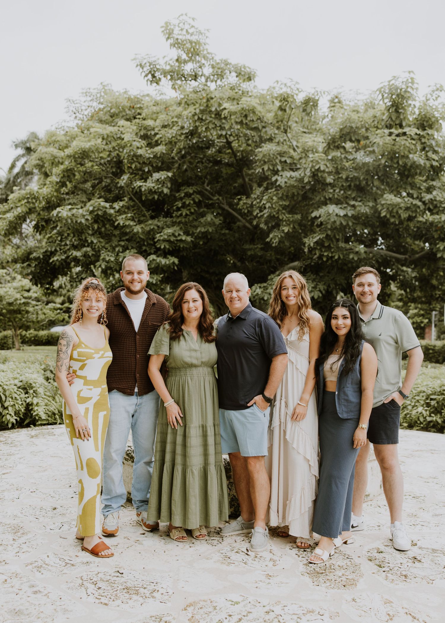 Large family photos in Downtown Palm Beach on the island, at a park and the beach captured by Lindsay McDow Photography