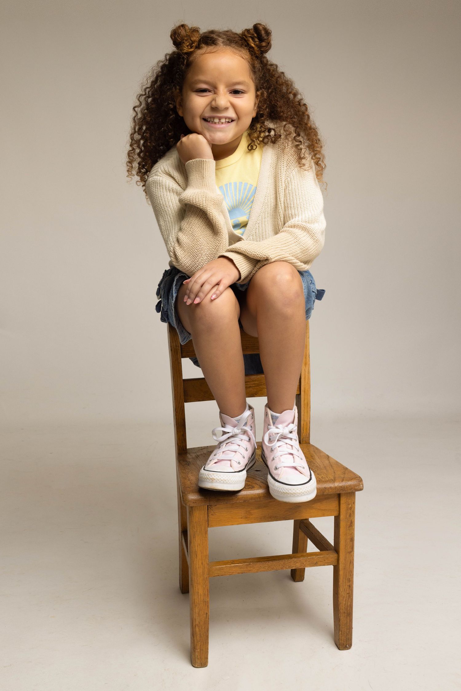 Children modeling portfolio shot by June Photography Studio.