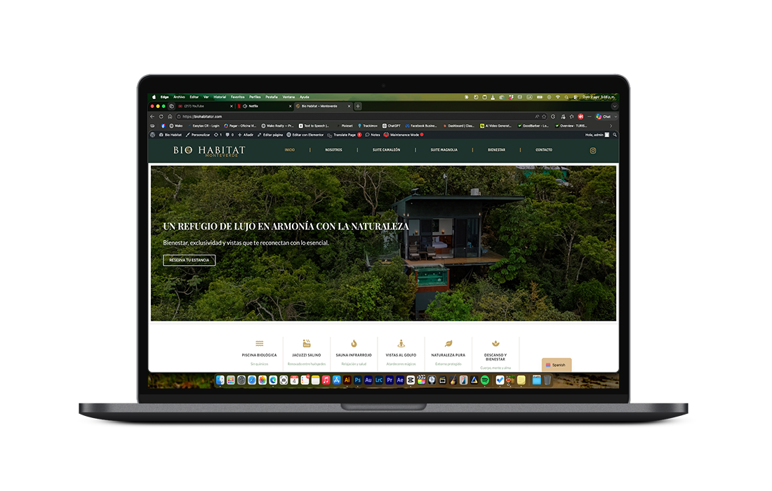 Laptop displaying an interior design website with multiple room photos in a dark theme.