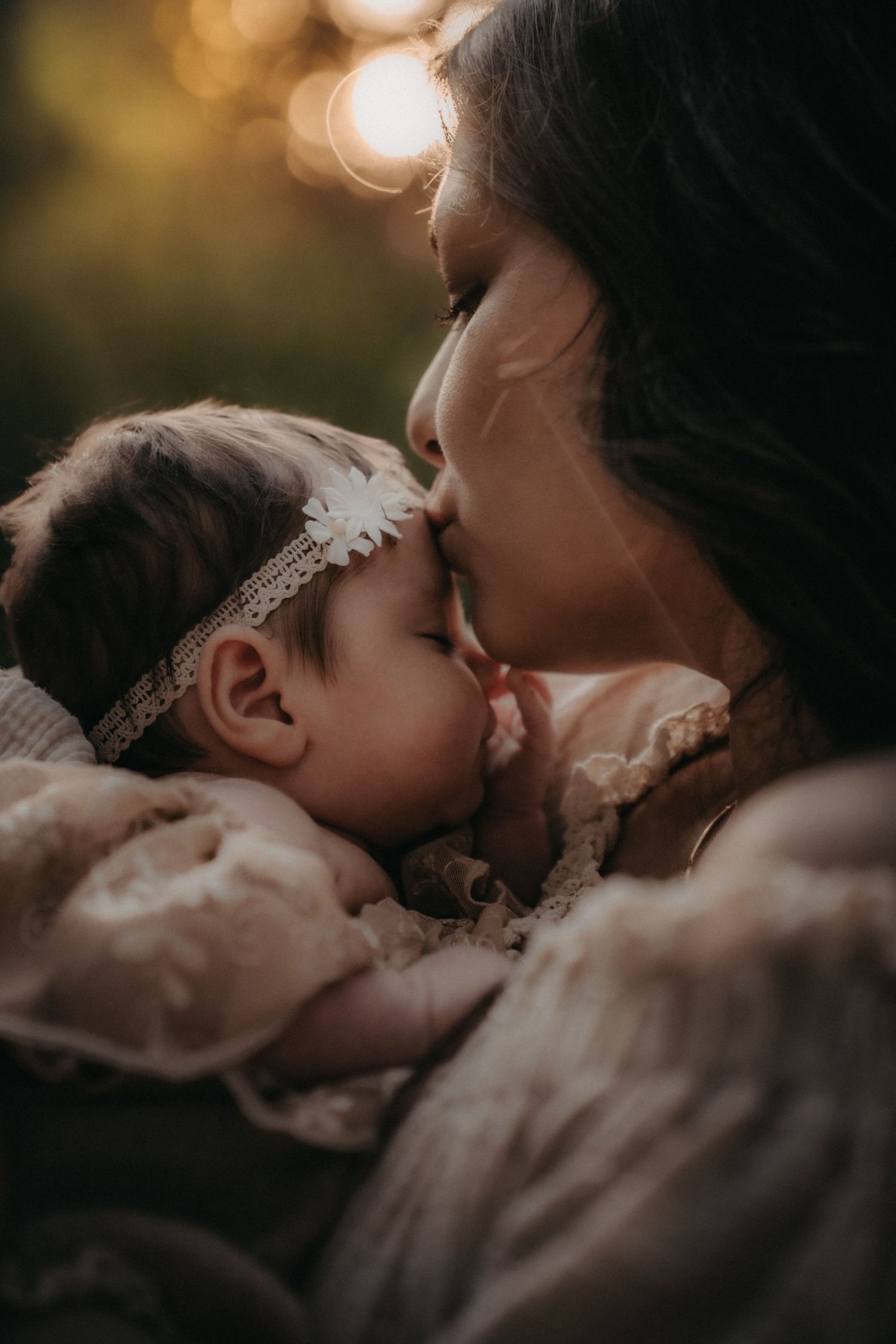 A gentle moment of affection captured in warm sunset lighting.