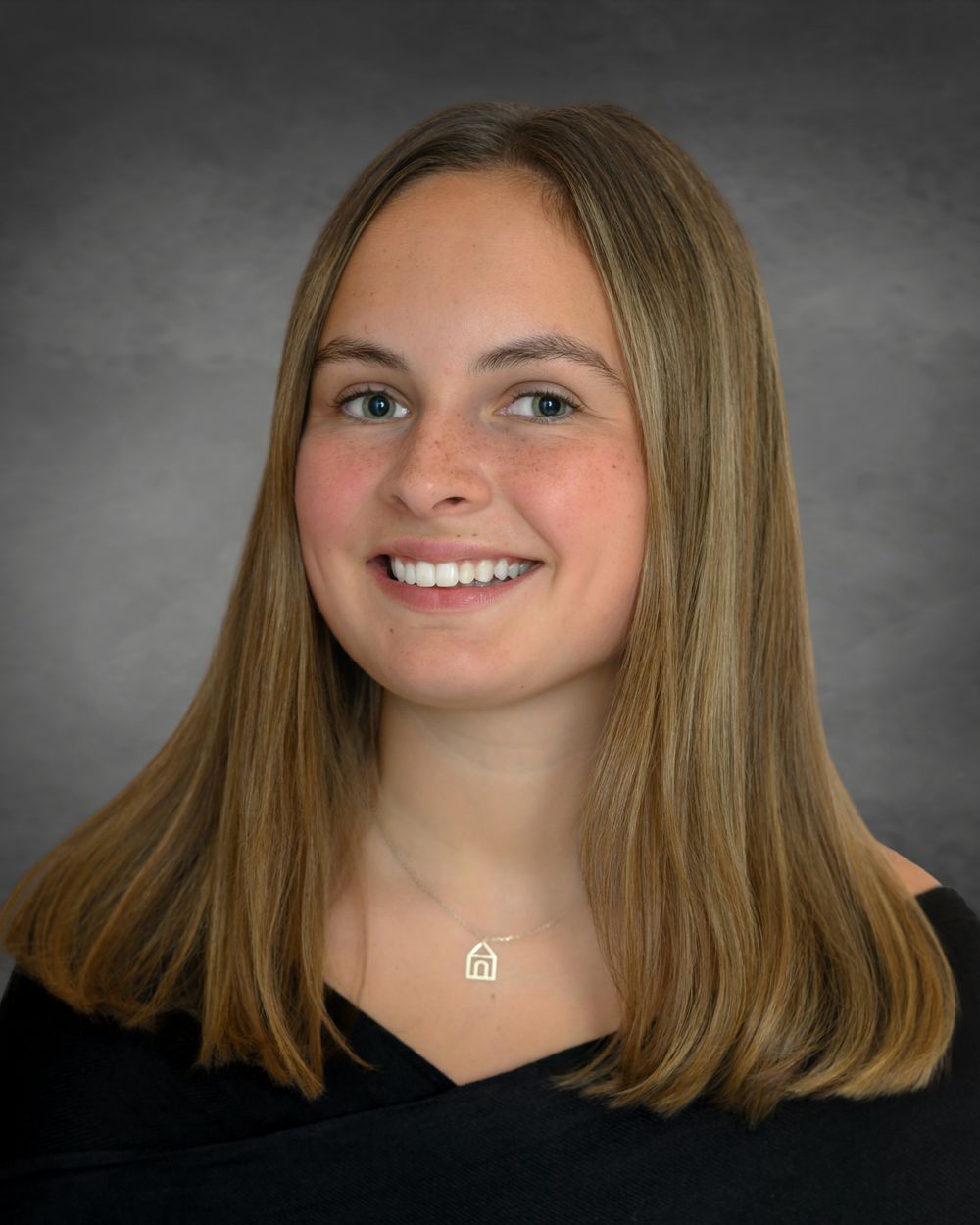 A series of four professional portrait shots showing a person with shoulder-length hair smiling against a gray background.