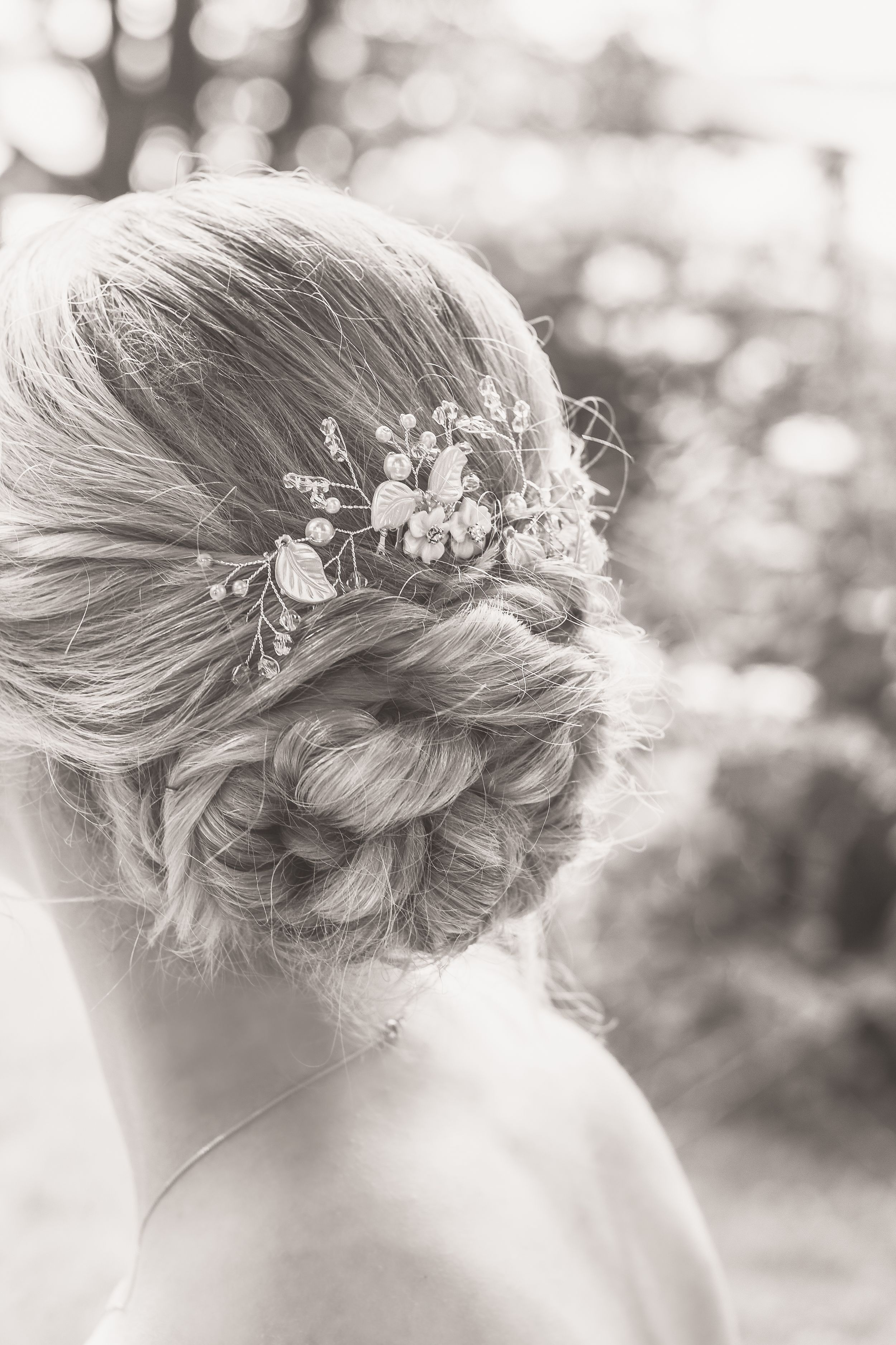 Black and white detail shot of a prom hair updo taken in Frost Park, Yarmouth, by Daneesha Williams
