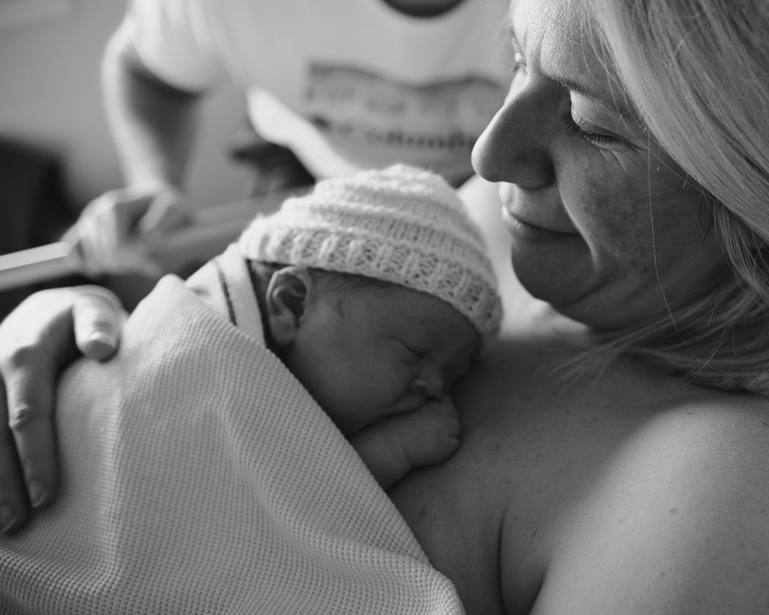 parents with newborn baby few hours after c-section birth in edinburgh lothian hospital