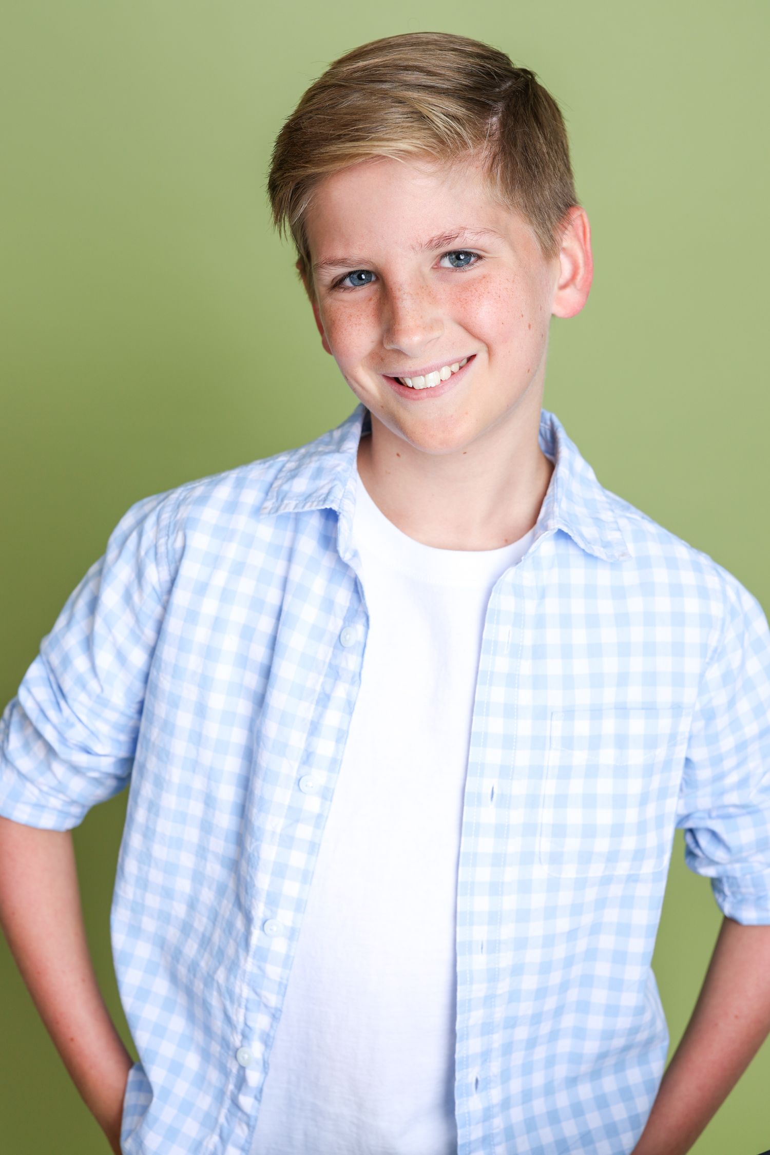 Series of photos showing a child in a blue gingham shirt and white t-shirt posing against a green background.