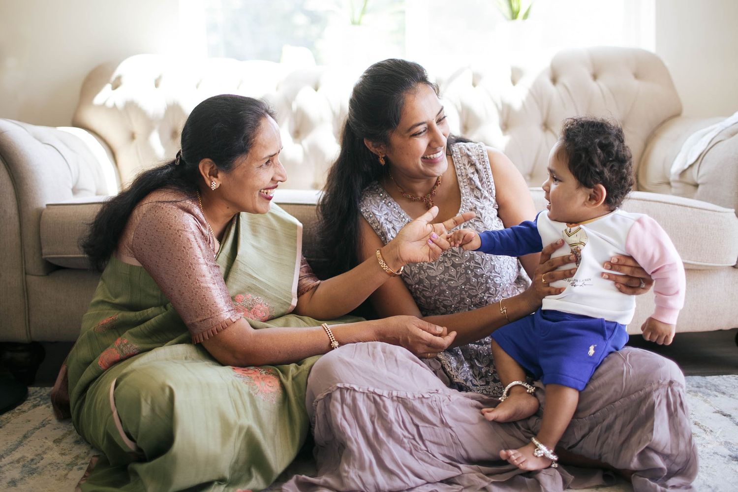 seattle lifestyle family photography: a lady with her mother and 1-year-old son at a family photo session at home