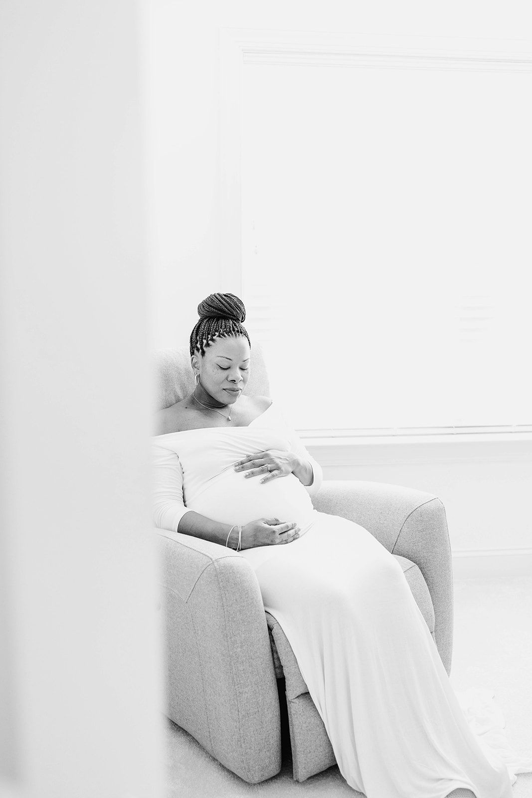 Artistic black and white portrait of an expectant mother in the newborn nursery of her home near Camp Hill, PA in Cumberland County.
