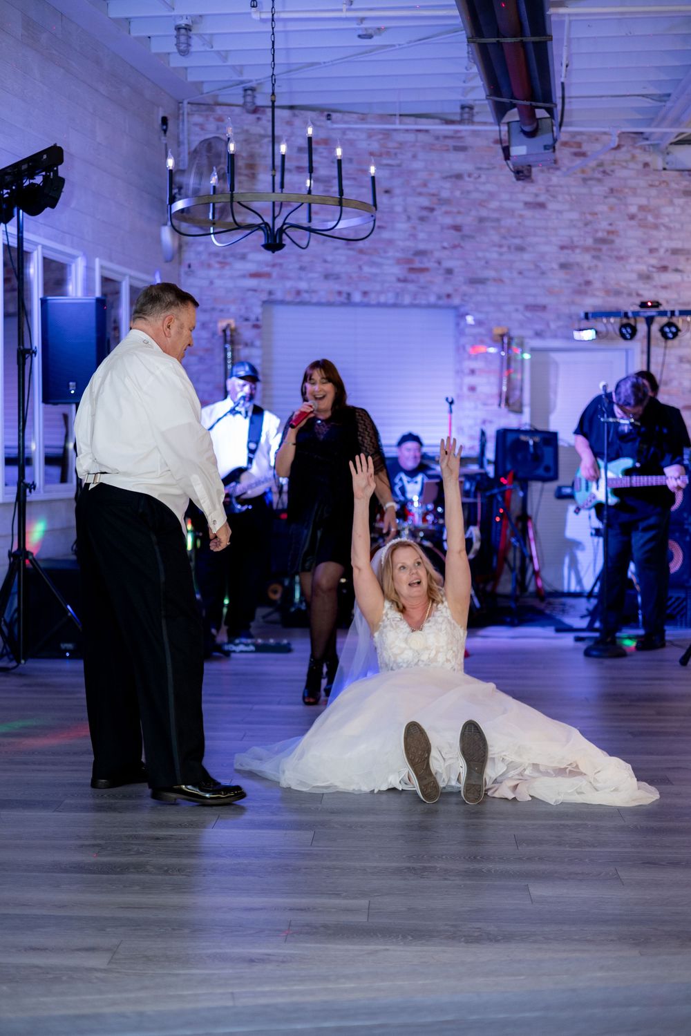 A sequence of dance floor images showing a bride in a white gown performing a fun falling dance routine at a wedding reception.