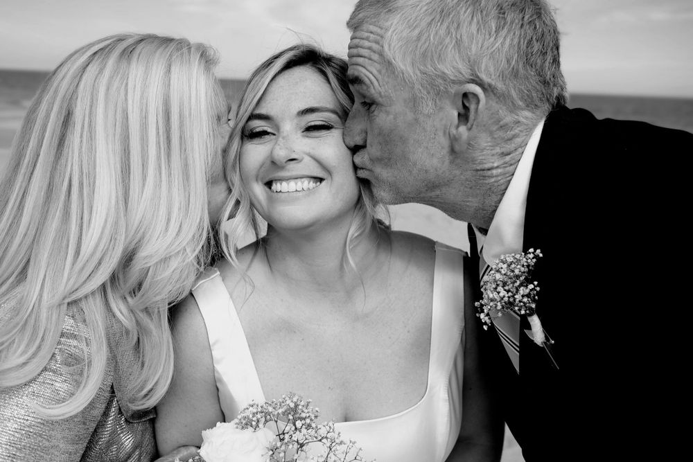 Sweet moment shared between loved ones during wedding celebration.