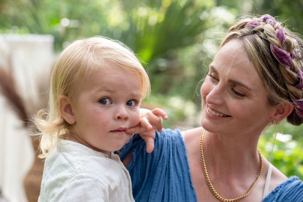 Candid expressions of joy during an outdoor family photo session.