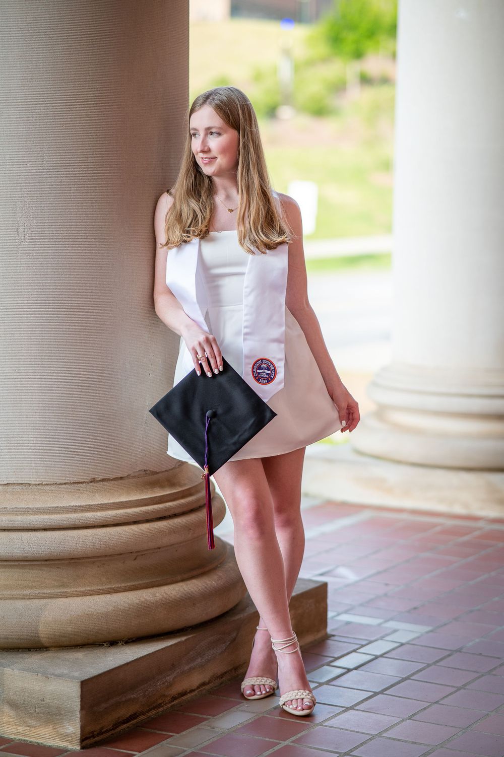 Clemson Graduate at Sikes hall with sash and cap at Clemson, South Carolina.