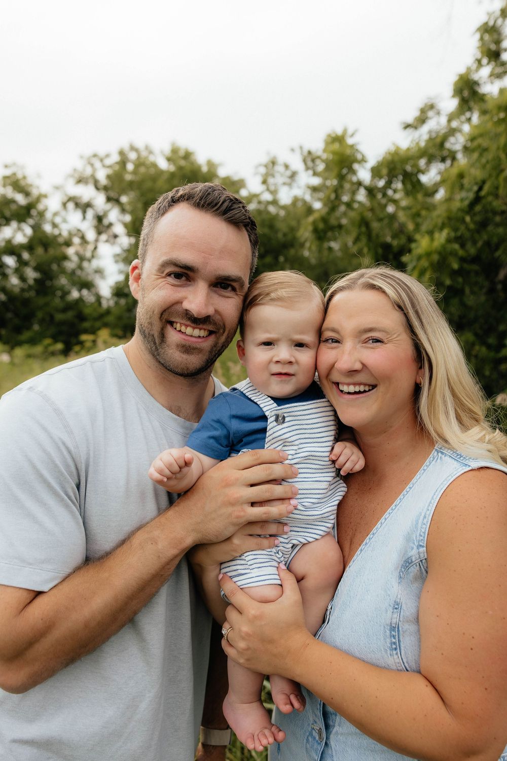 A loving family of three shares tender moments together outdoors in a series of connected candid photos.