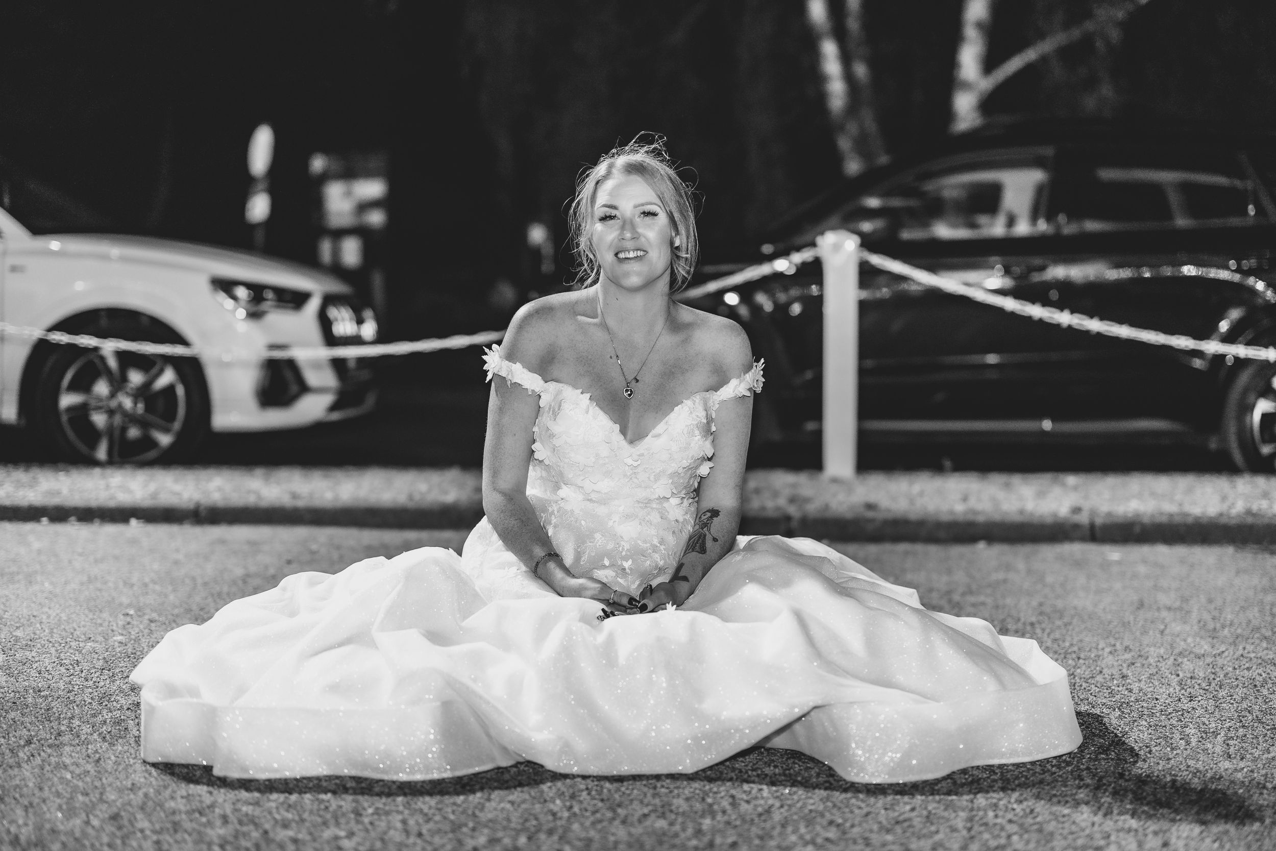 Black and white wedding portraits taken outdoors with creative composition.