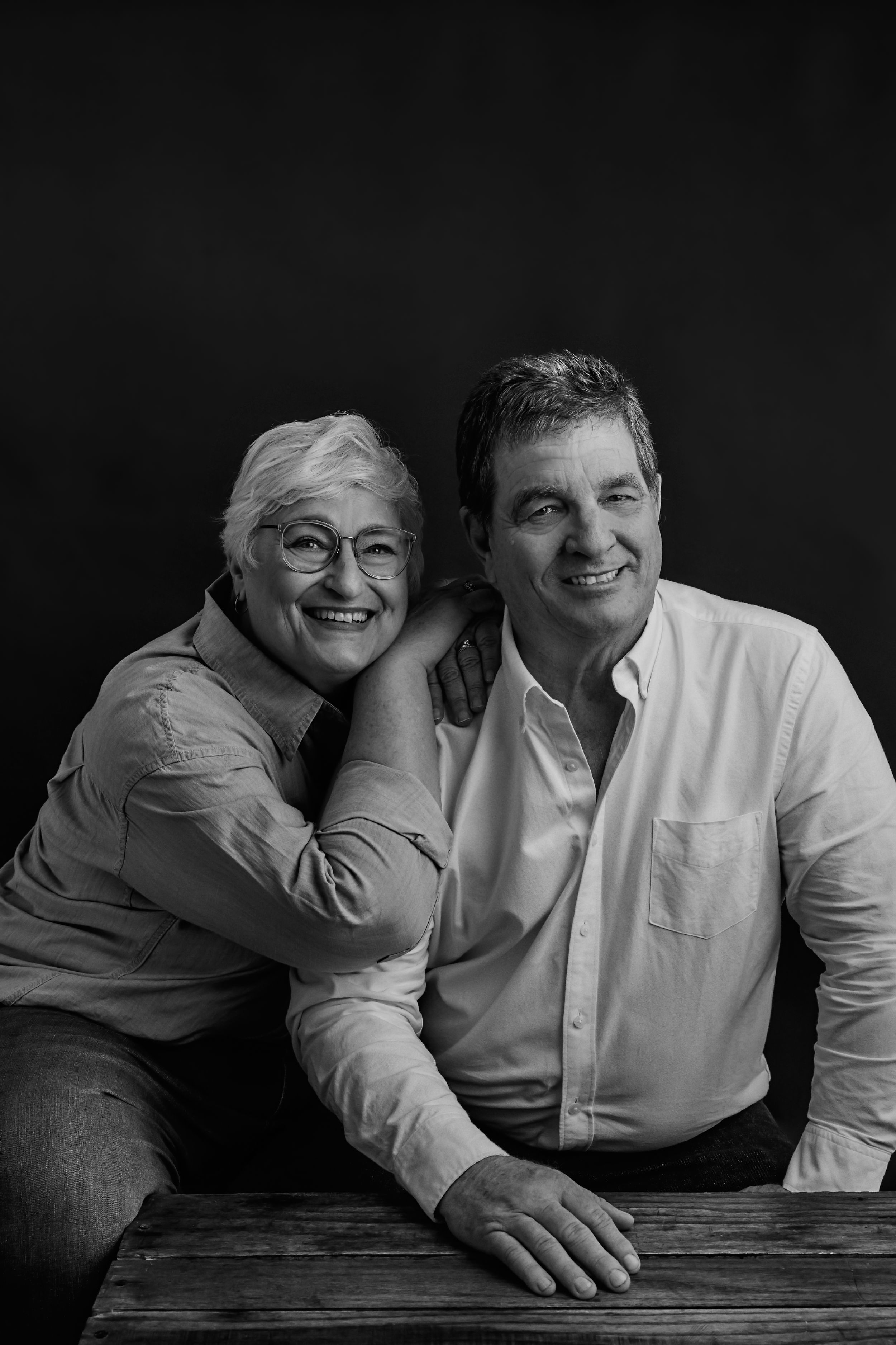 Intimate black and white portrait series showing close interaction between two people.