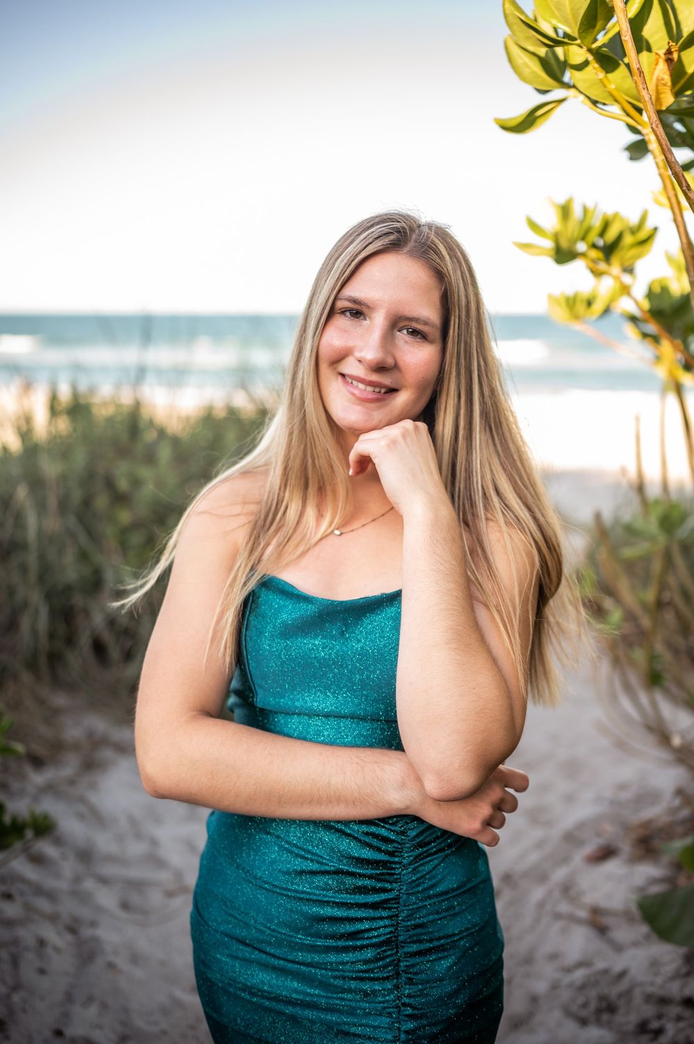 Senior girl graduation photoshoot session smiling in green dress sunset beach Melbourne Cocoa Vero Florida Brevard County