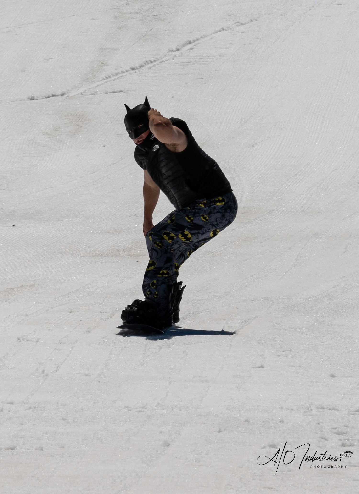 Sequential action shots of snowboarder sliding down snowy slope.