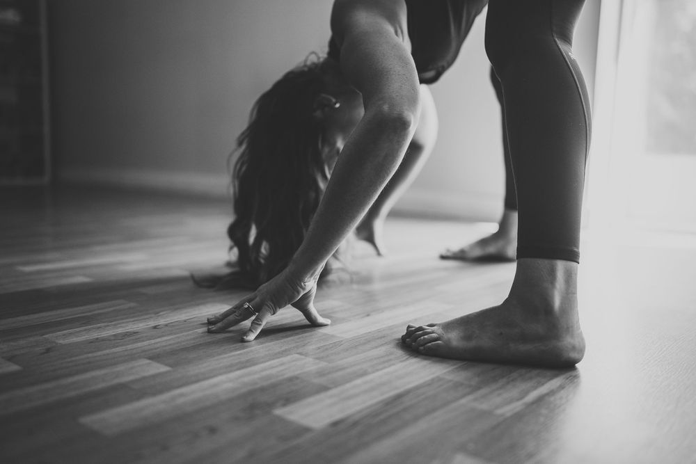Black and white photo series showing feet dancing in heels and dress shoes casting dramatic shadows on the floor.