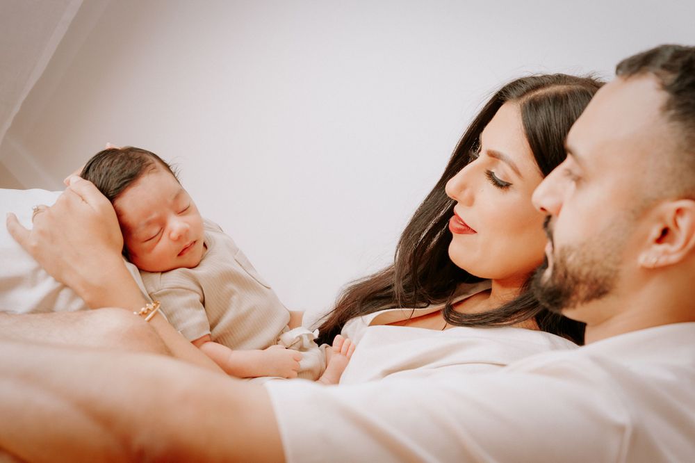 Family relaxing together on bed in warm natural light.
Altona Family Photographer Melbourne