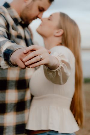 Close-up shots of a couple sharing an intimate dance moment in soft natural lighting.