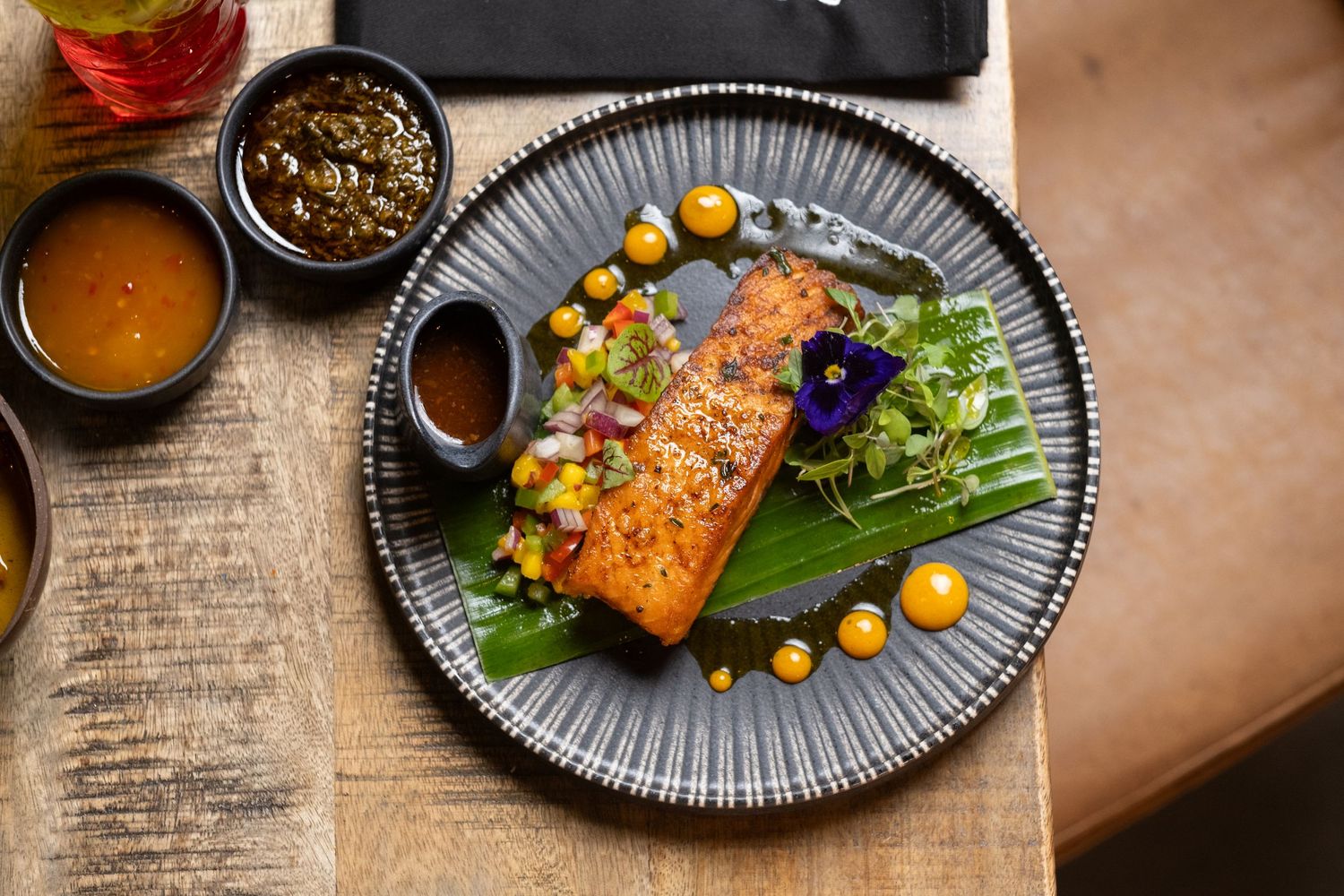 Top down shot of Jerk salmon dish at Jerk Junction kitchen, Wilmslow Manchester.