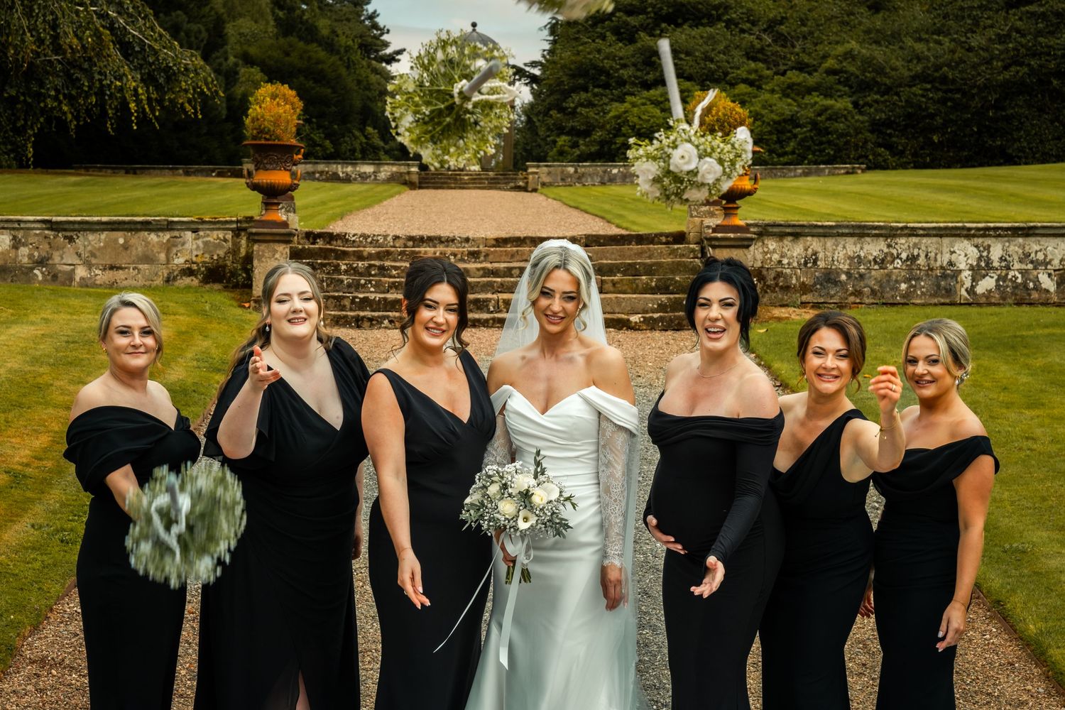 Bouquet throw for dynamic shot whilst capturing guest photos at luxury wedding venue Hawkstone hall and gardens, Shropshire.