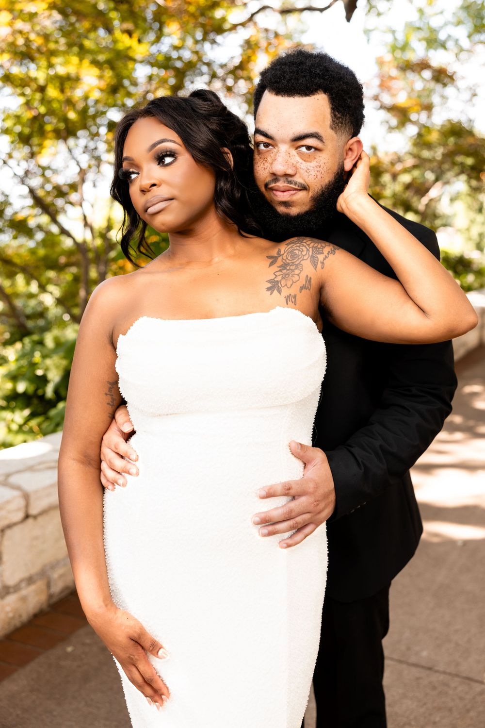 Romantic outdoor wedding photos with couple in black and white attire.