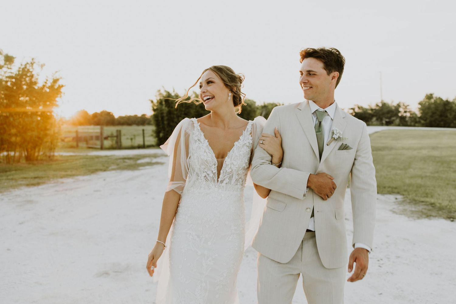 Okeechobee Florida summer wedding at Ever After Farms Stockyard Barn. Sunset golden hour bride and groom portraits.