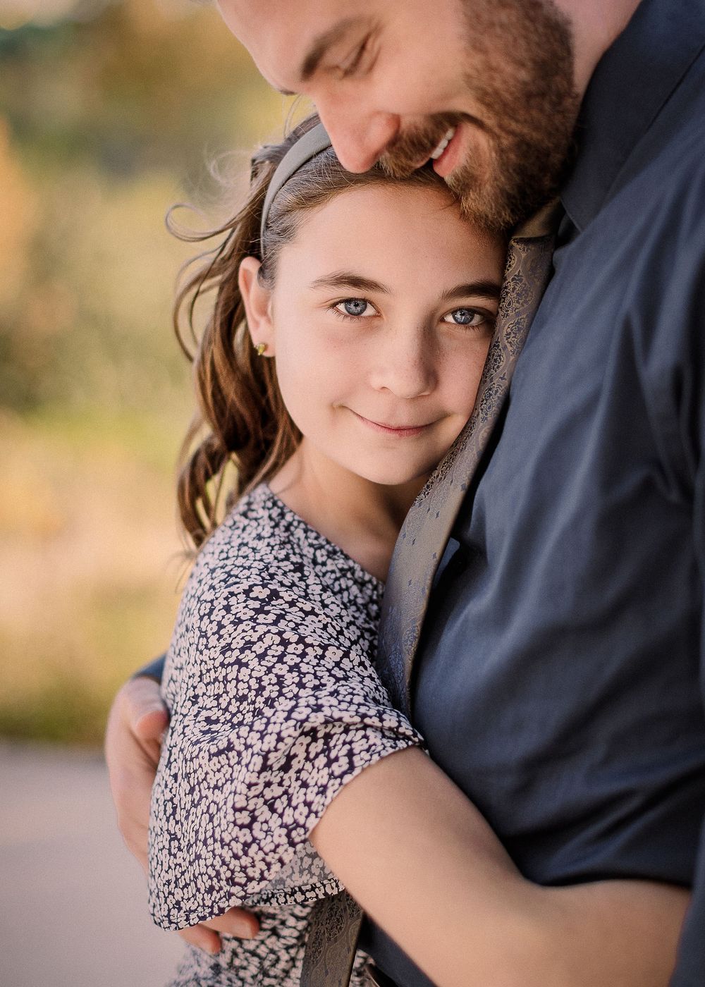 San Antonio Family Photographer capturing father and daughter Hugging. San Antonio family Photographer