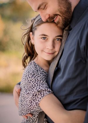 San Antonio Family Photographer capturing father and daughter Hugging. San Antonio family Photographer