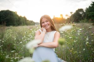 Summer portraits in a wildflower field during golden hour.
